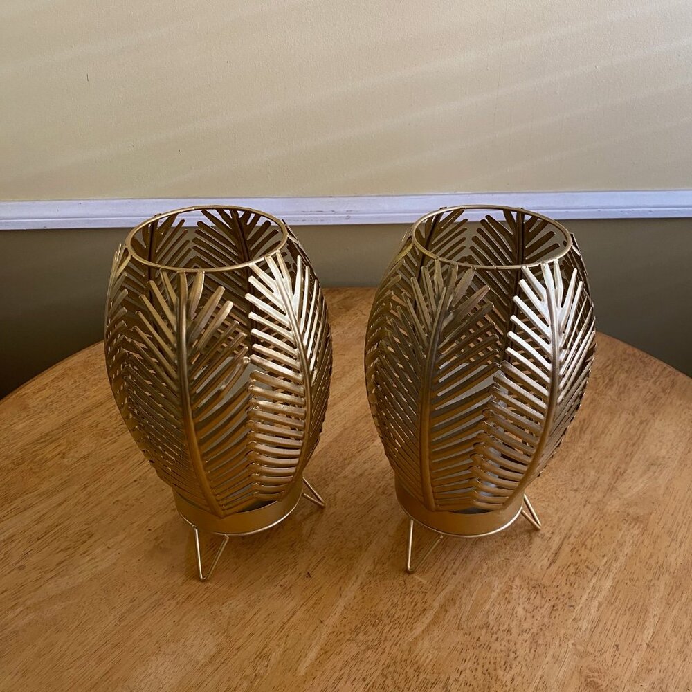 2 Lamps with lighted candles, palm tree leaf design,both lights work.